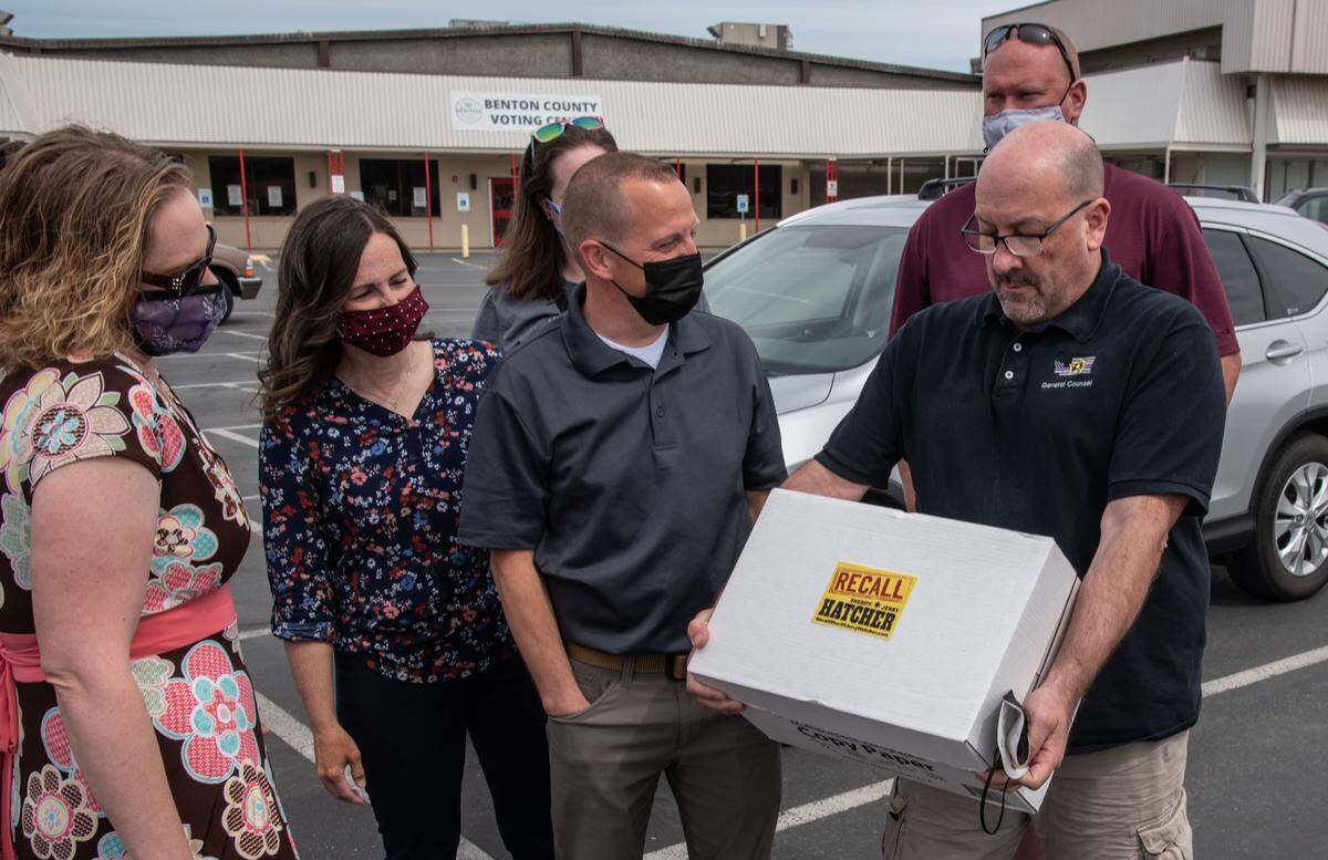 Organizers submit the petitions for a ballot measure on recalling Benton County Sheriff Jerry Hatcher.