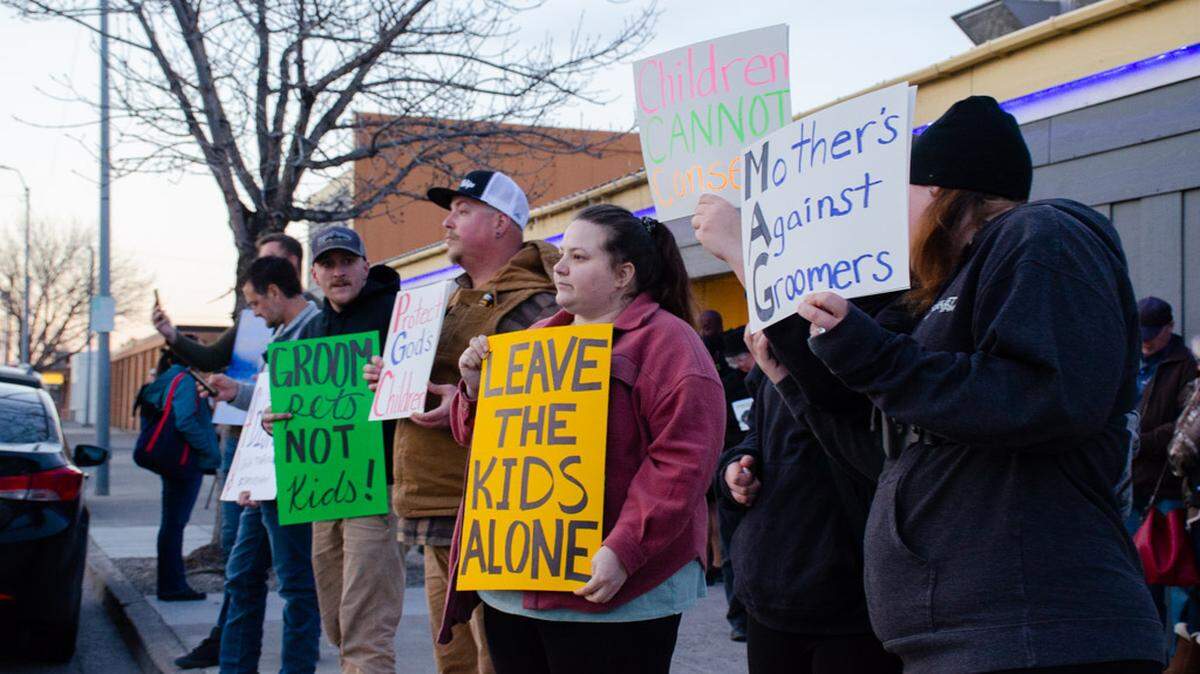 Protesters gathered Wednesday night outside Out and About night club in Pasco, WA in opposition to an all-ages Disney-themed drag show. 
