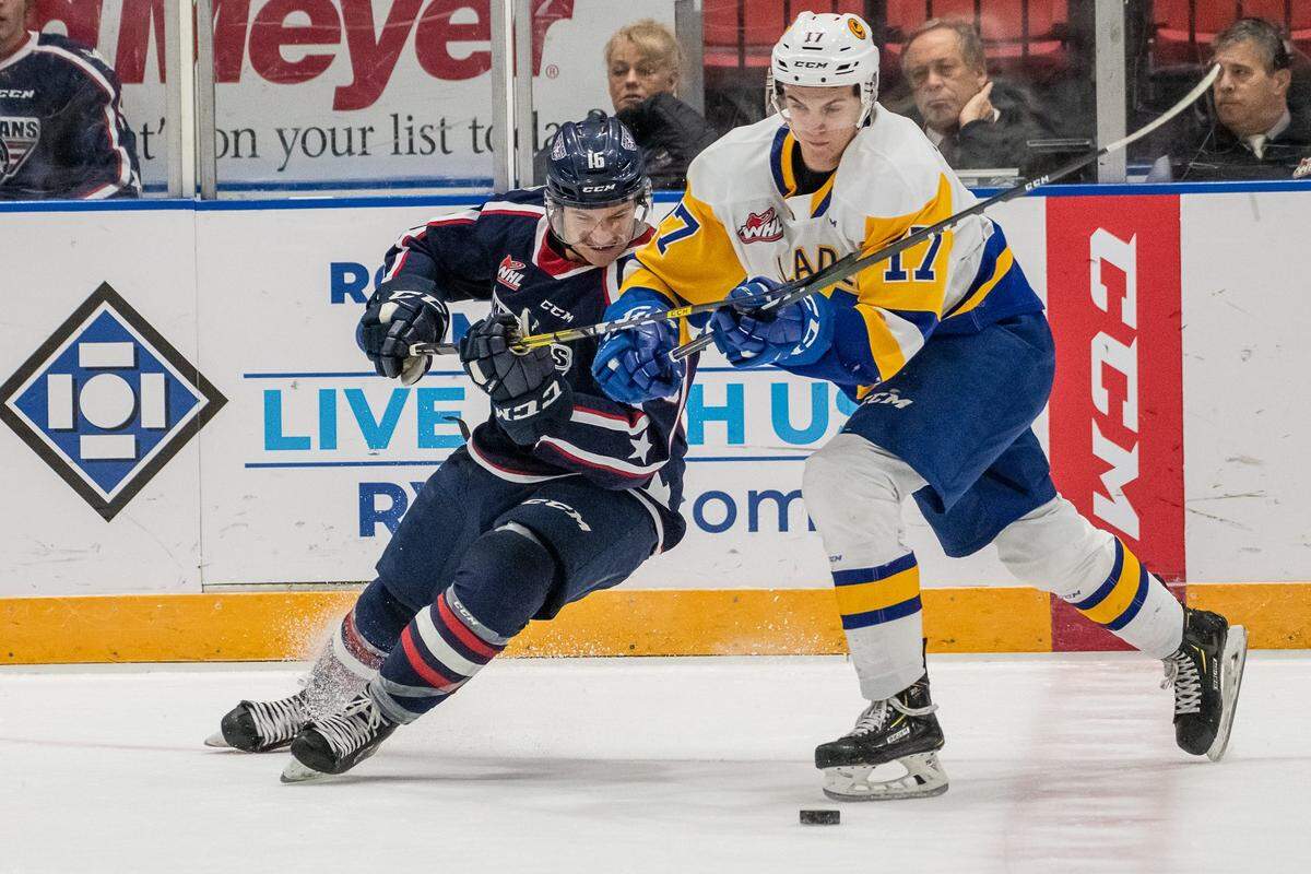 Tri-City’s Nick Bowman (16) battles for the puck with Saskatoon’s Eric Florchuk during their Nov. 27 game at Toyota Center. The Blades won 2-1.