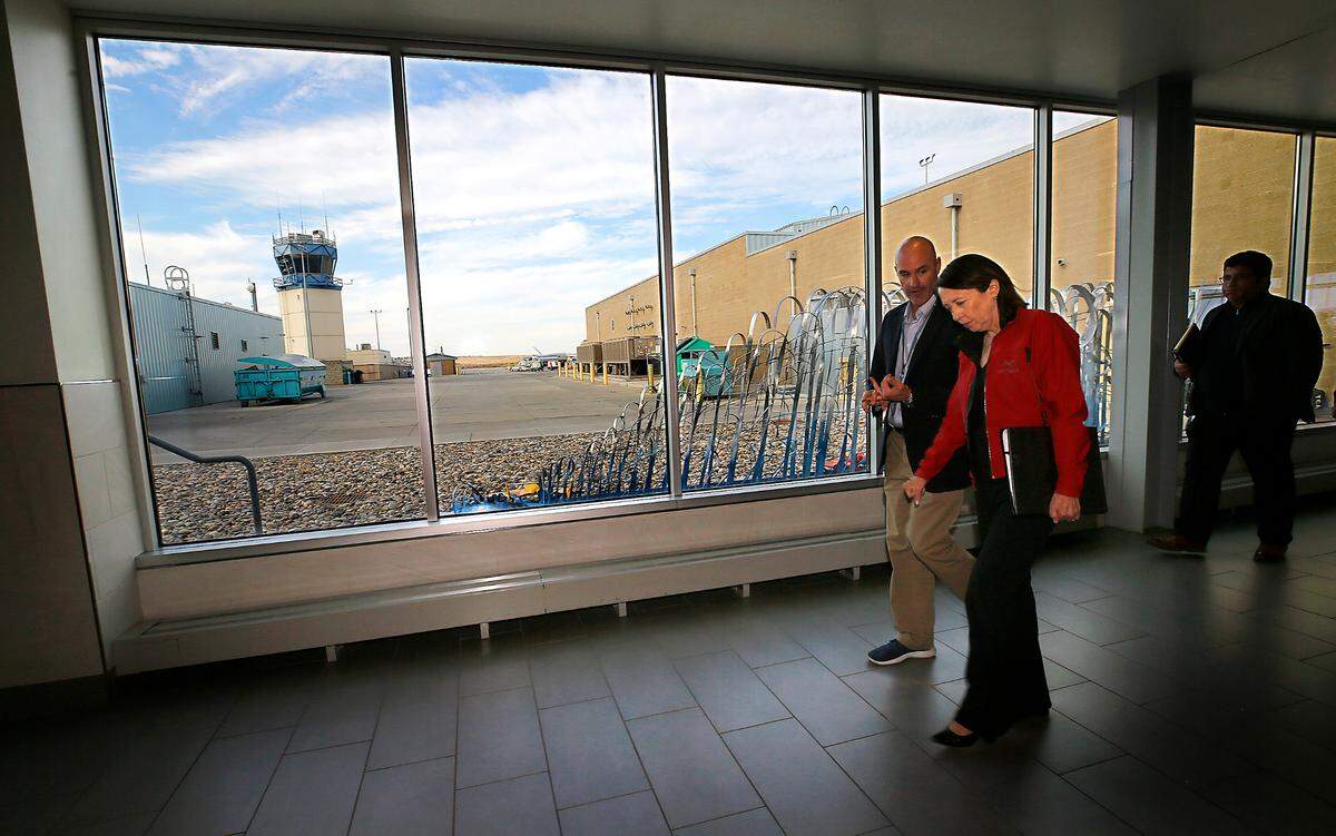 Buck Taft, Tri-Cities Airport director, guides Sen. Maria Cantwell on a tour of the airport terminal in Pasco. The visit followed an announcment of a $4 million federal grant as part of a 10-year renovation plan of the aiport.