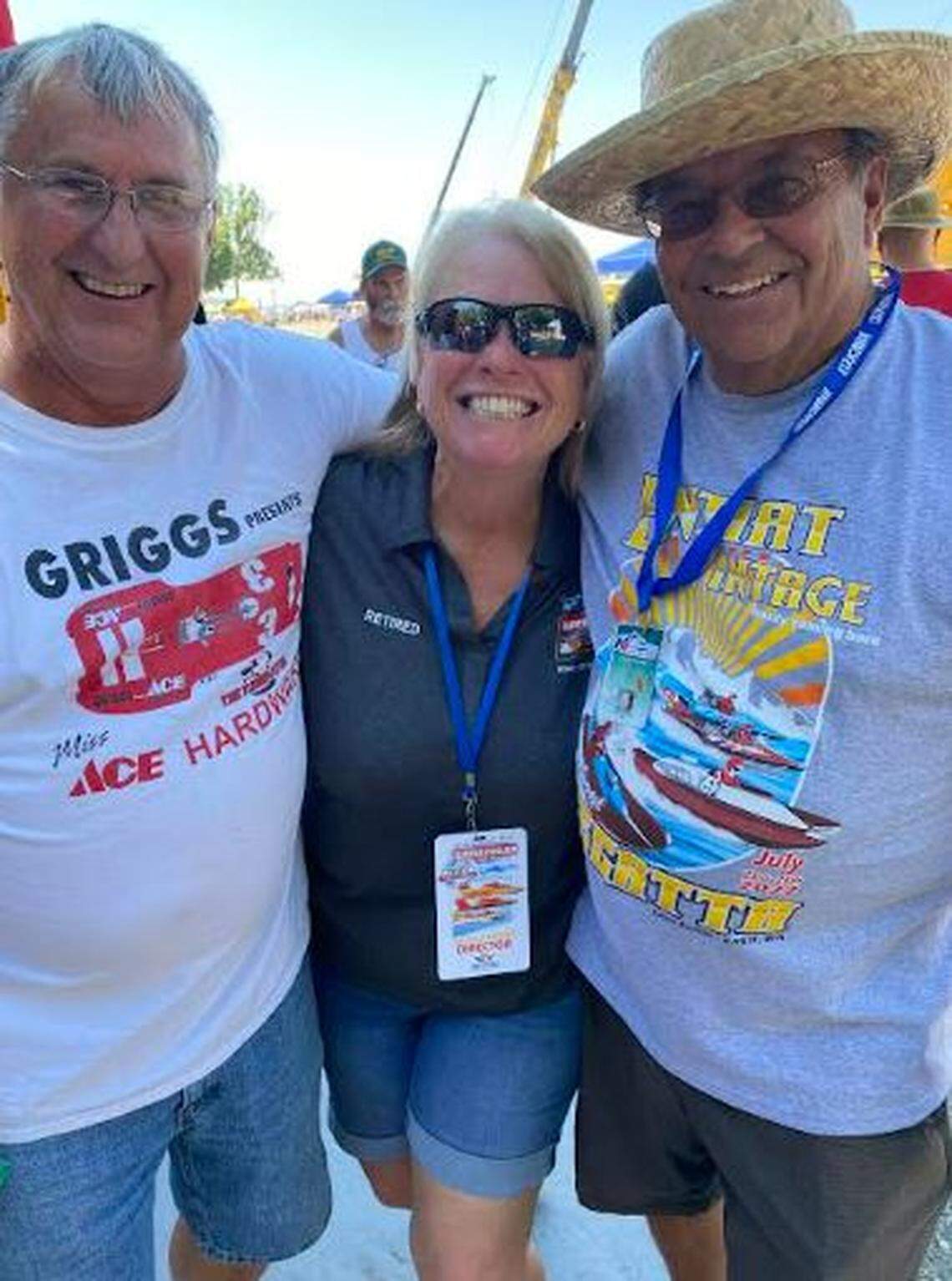 Kathy Powell poses with Mitch Evans, left, and John Walcker, during this weekend’s Tri-Cities Water Follies events. Powell is retiring as event director after 16 years.