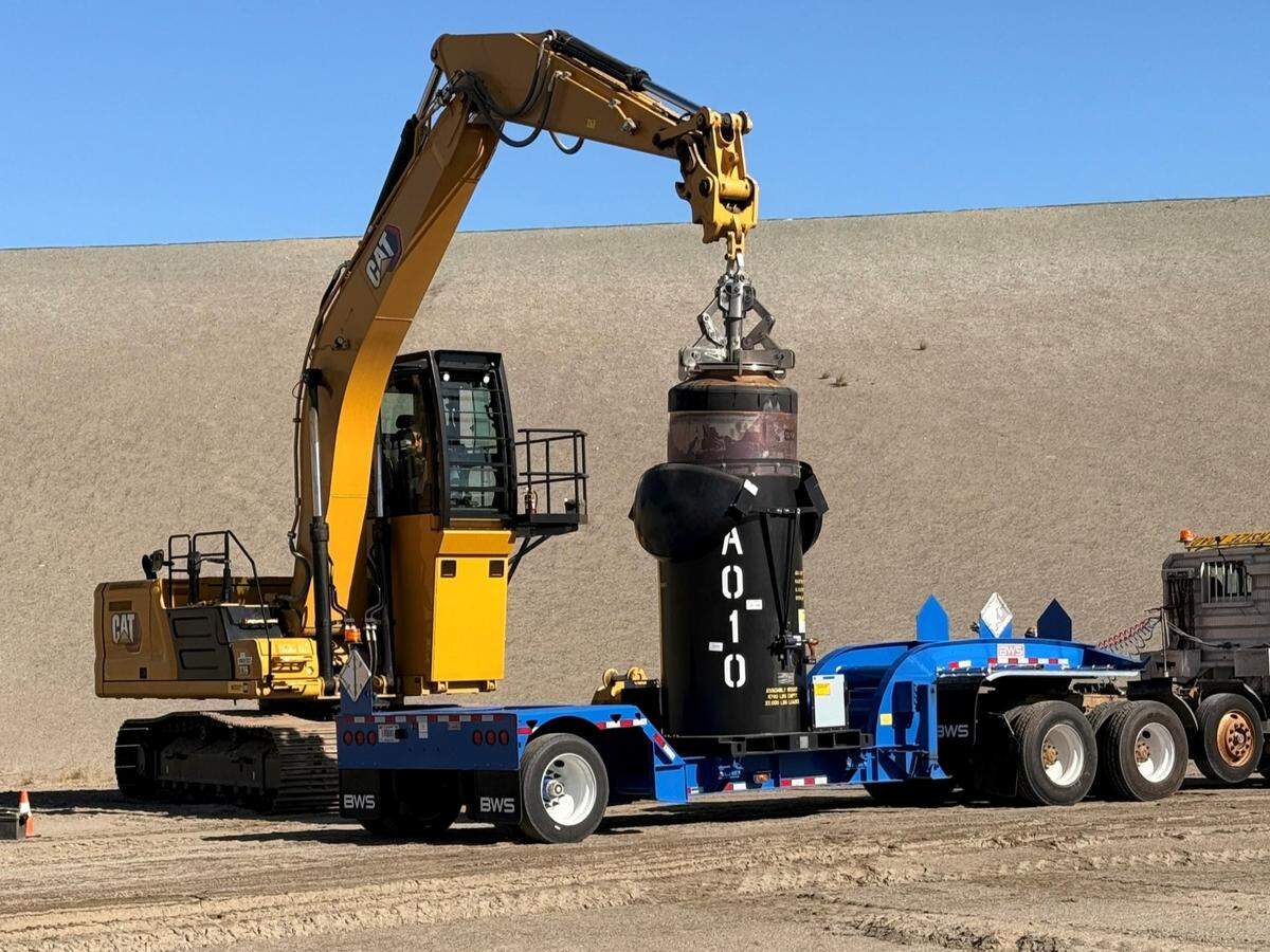 The first container of radioactive waste glassified at the Hanford nuclear site vitrification plant was disposed of in a lined landfill Wednesday.