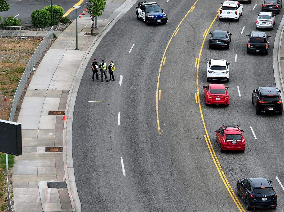 Richland officials at the scene of Friday's fatal crash on George Washington Way at Jadwin Avenue. 
