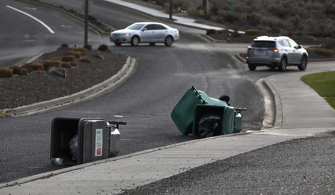 Garbage cans along West Canyon Lakes Drive in Kennewick didn’t stand a chance in Tuesday’s winds gusting up to 55 mph. A wind advisory issued by the National Weather Service remains in effect until 1 p.m. Wednesday across the Mid-Columbia.