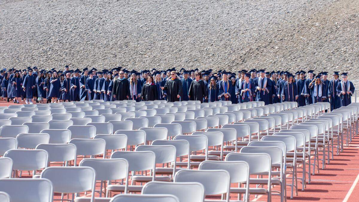 Chiawana High School graduates receive their diplomas in 2022 during the school’s outdoor commencement ceremony in Pasco.