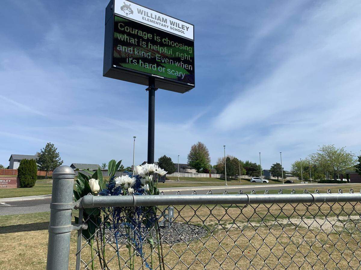 Flowers were placed at William Wiley Elementary School in West Richland after paraeducator Amber M. Rodriguez was shot outside of the school. 
