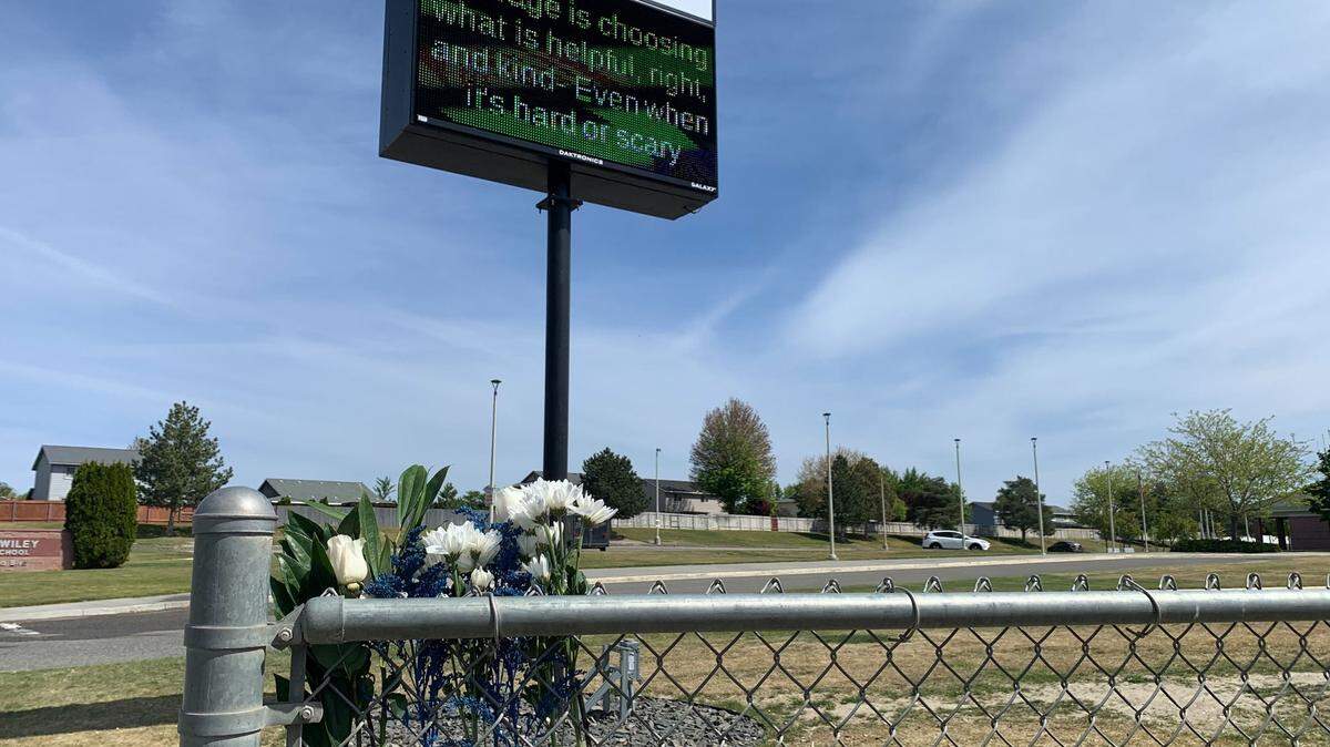 Flowers were placed at William Wiley Elementary School in West Richland after paraeducator Amber M. Rodriguez was shot outside the school on April 22.
