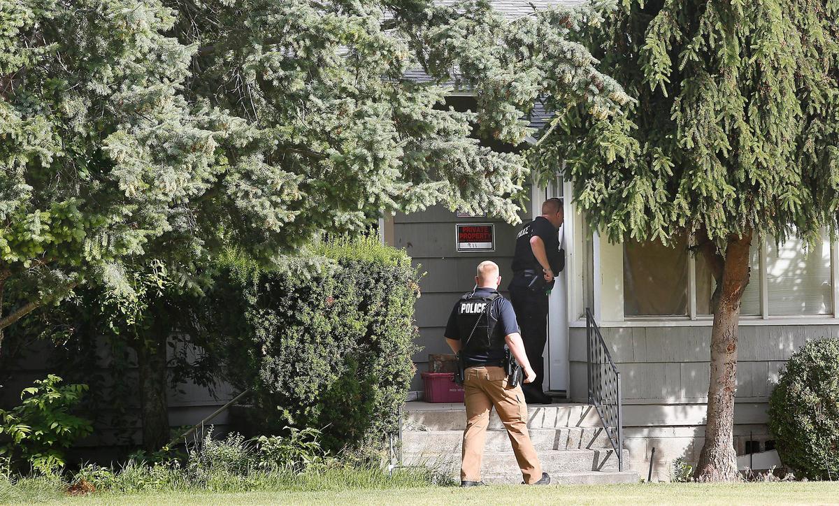 Kennewick Police officers check a residence in the 3500 block of South Garfield Street for a wanted person during Tuesday’s Operation Safe Streets II criminal roundup sweep throughout the Tri-Cities. Watch a video at: tricityherald.com/video