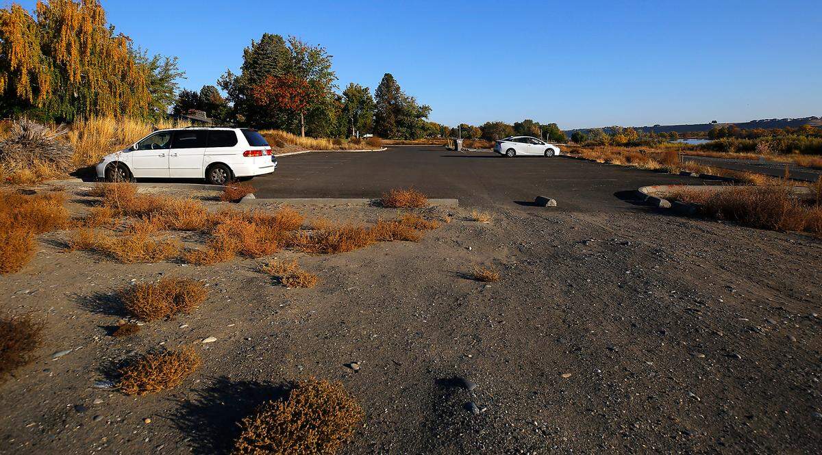 A couple of cars sit in the parking lot for Leslie Groves Park off Harris Avenue at Newcomer in north Richland.