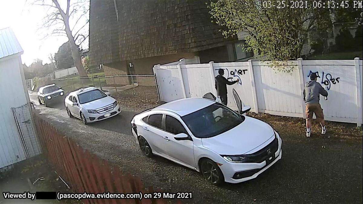 Three teens were arrested in connection with graffiti in Pasco. A 16-year-old was arrested in connection with two guns found in a car. The grafitti was digitally altered in this picture by police.