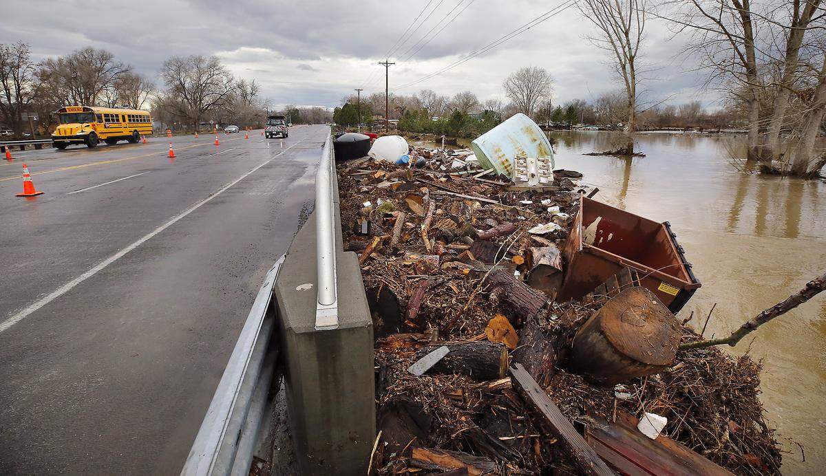 The box culvert bridge on Van Giesen Street near Buckskin Lane in Richland is choked with debris as floodwaters from the Yakima River recede Monday after cresting over the weekend. The WSDOT is planning to clear the debris and inspect the bridge for any damage.