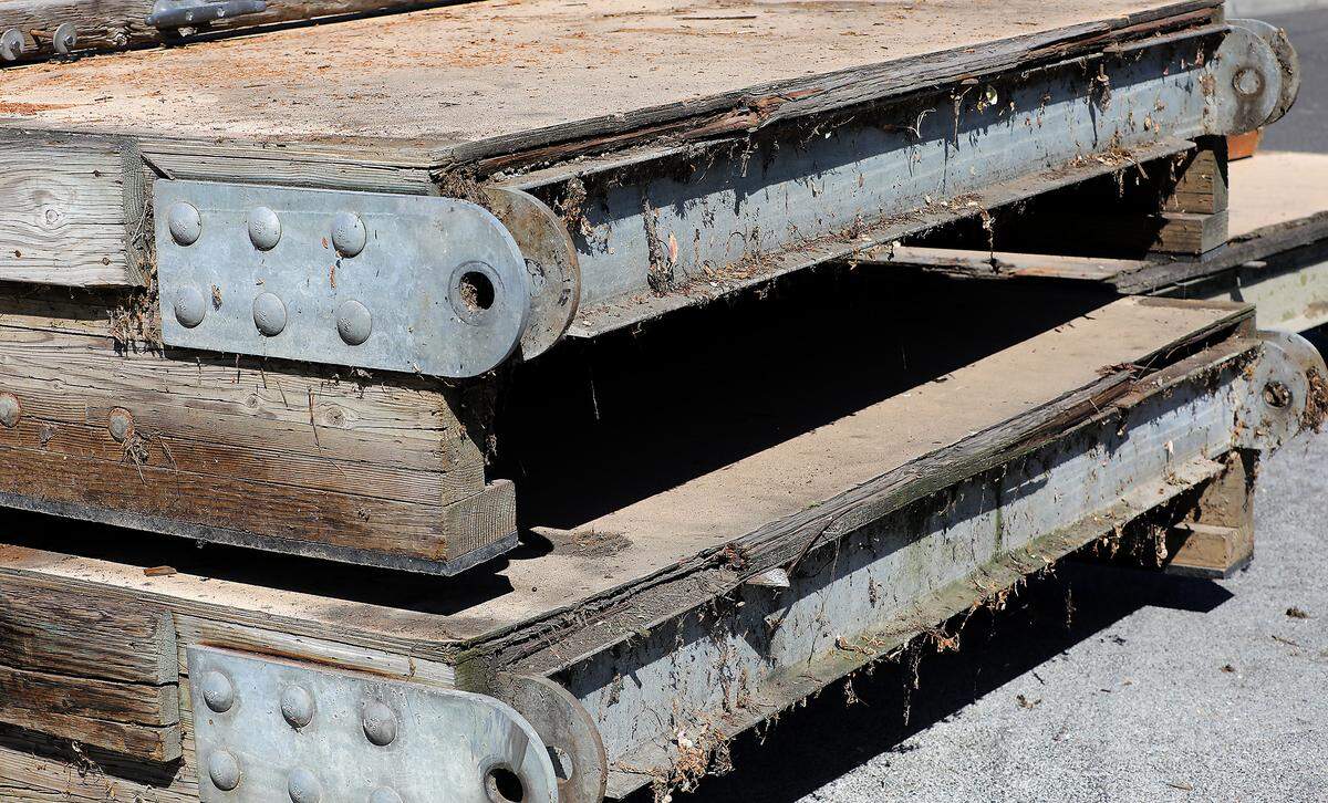 The aging wooden decking is being replaced with new launch floats.