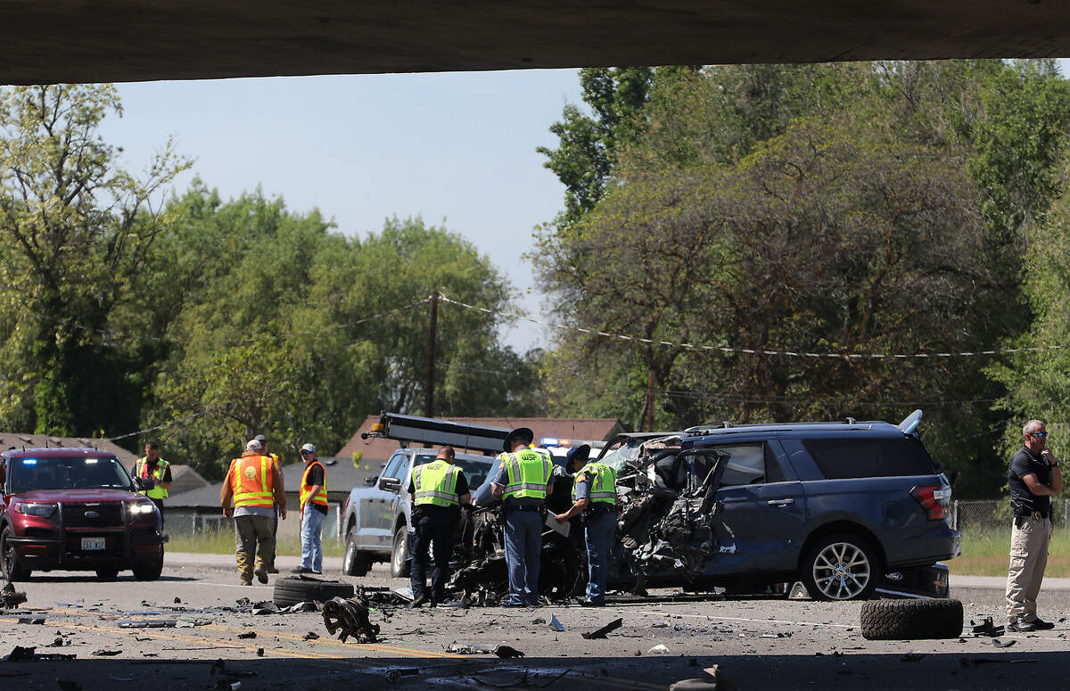 Washington State Patrol troopers investigate the scene of Thursday's double fatal collision at the Lewis Street exit on Highway 395.