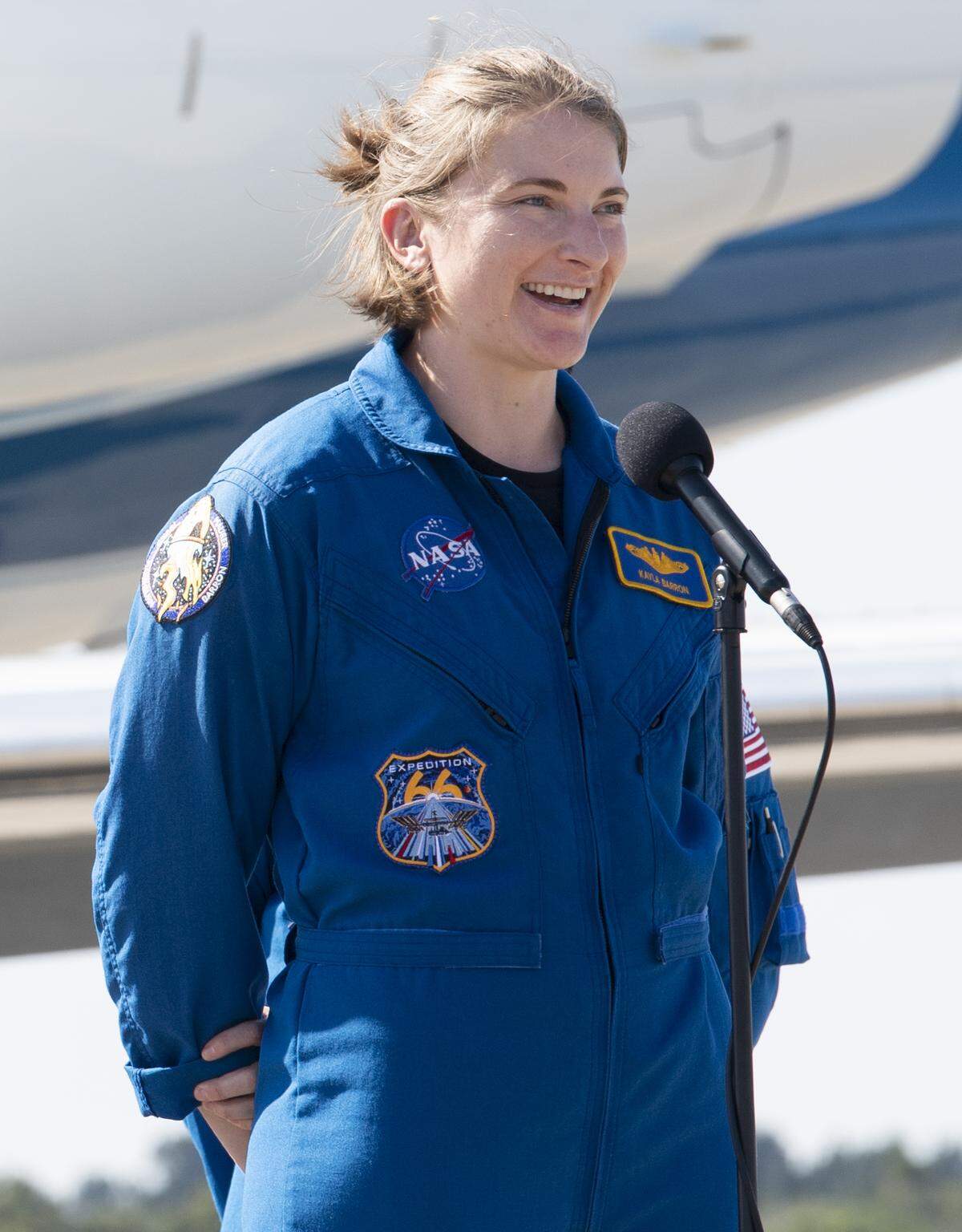 NASA astronauts Kayla Barron speaks to members of the media after arriving from Houston at the Launch and Landing Facility at NASA’s Kennedy Space Center.