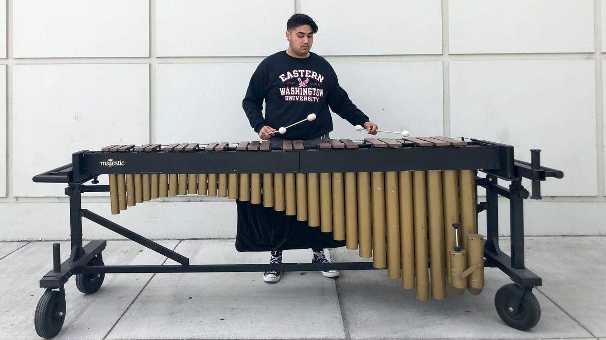 Aiden Burrows plays the marimba outside Pasco High School, where he's been a standout music student. He's headed to Eastern Washington University to continue his music studies.
