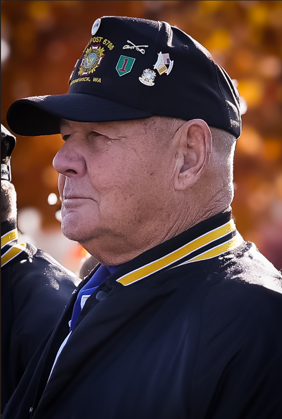 A member of VFW Post 5785 in Kennewick stands in formation before the 21-gun salute opening the 26th annual Tri-Cities Veterans Day Parade in West Richland, Wash., on Saturday, Nov. 8, 2025.