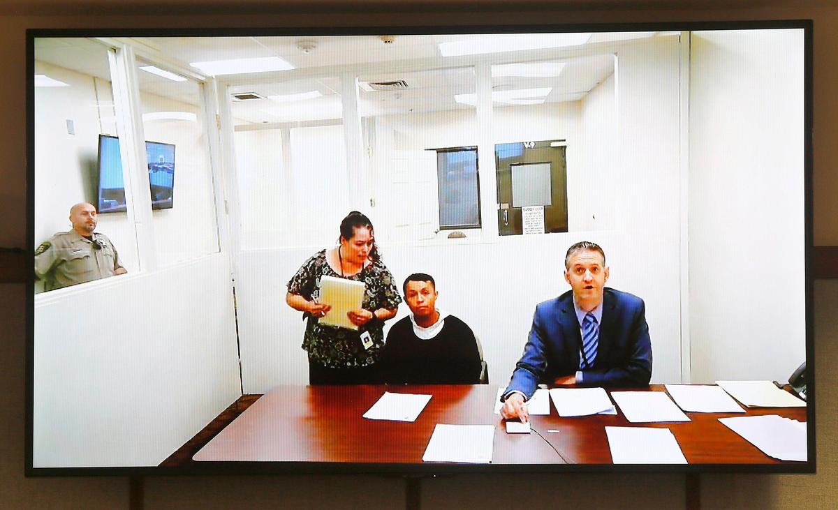 Sergio Garin-Villalobos, seated at left, appeared in Franklin County Superior Court in 2019 after his arrest for a November 2018 hit-and-run crash that killed a Pasco father of four.