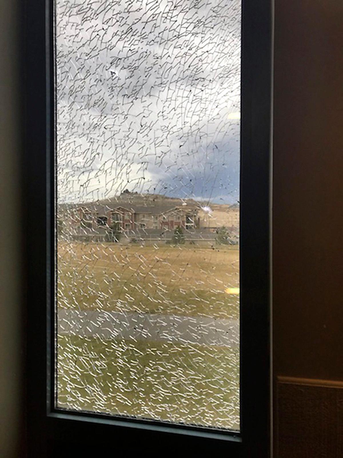 Kennewick police have arrested 2 students accused of shooting more than 60 windows at Southridge High School with a BB gun.