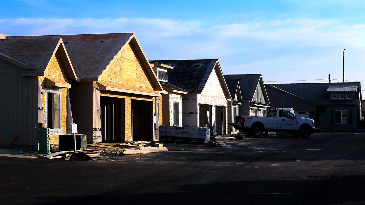 Work continues on some of the units at the partially completed 84-unit duplex project by Big Sky Developers called Sandy Flats in west Pasco. Lawmakers in Olympia are working together this year on bills aimed at easing housing woes.