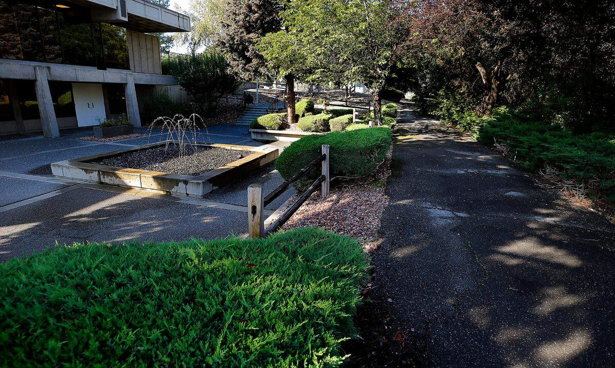 A shaded stretch along the Urban Greenbelt Trail passes by a fountain at the Banner Bank on Jadwin Avenue in Richland.