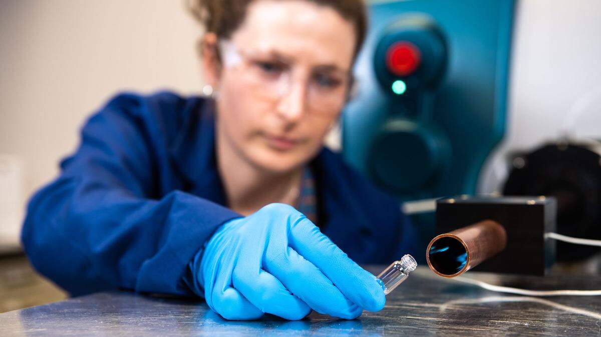 Elizabeth Denis, a chemist at PNNL, demonstrates a technology that can “sniff” the air and detect extremely low levels of explosives, such as nitroglycerin and the explosive in C-4, from more than eight feet away.