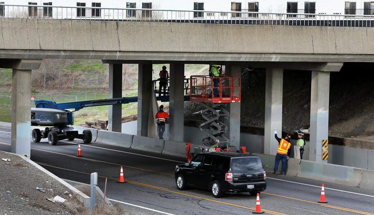 Washington Department of Transportation repair crews started Monday morning working underneath the West Fourth Avenue overpass bridge which carries traffic on Highway 395 in Kennewick.
