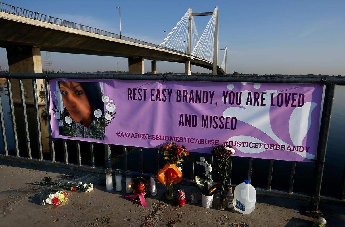 A memorial with flowers, candles and a large banner honors homicide victim Brandy Ebanez of Kennewick. Her body was discovered Sept. 27, 2022, along the Kennewick shoreline of the Columbia River by a fisherman downstream of the cable bridge.