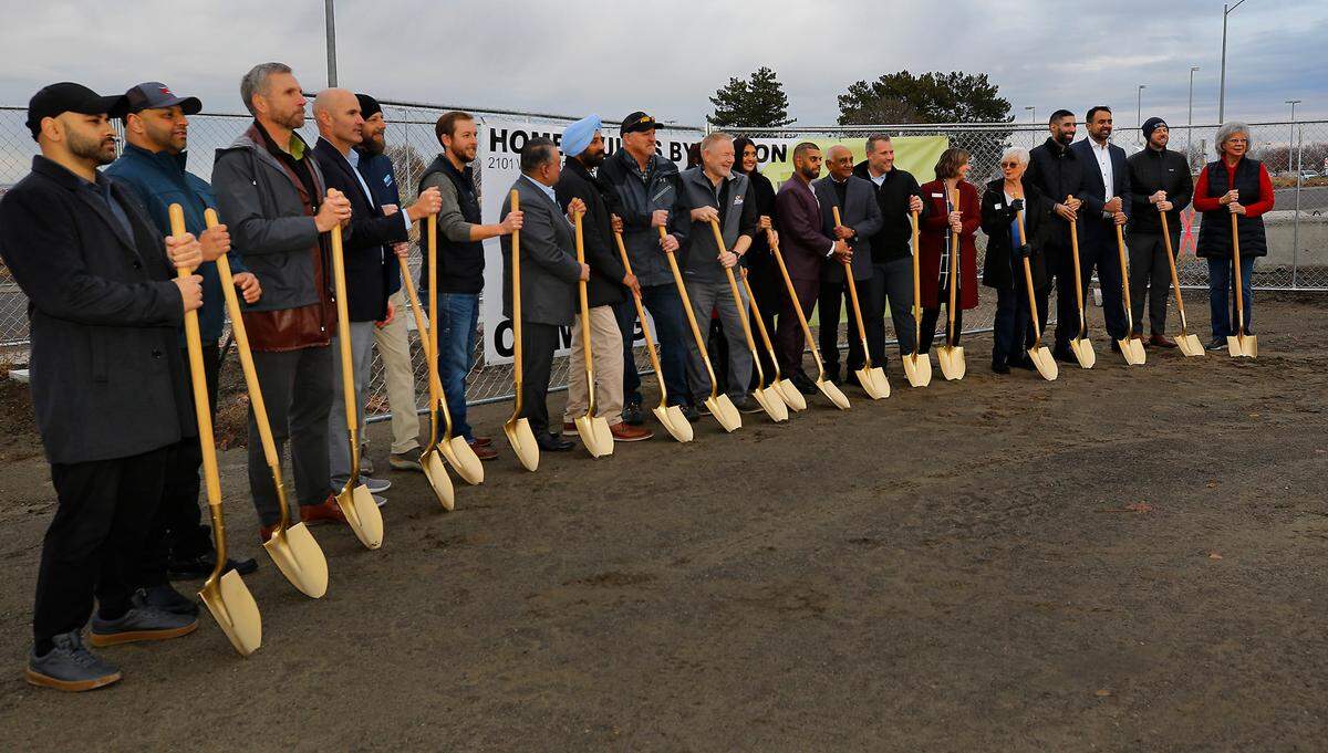 A-1 Hospitality, led by president Vijay Patel ,left, and son, Taran Patel, managing principal, held a ceremonial groundbreaking event for a new hotel, Home2 Suites by Hilton, on West Argent Road, between its existing Courtyard by Marriott and a Circle K to the west. The two men, one wearing a maroon coat and the other gray, were surrounded by friends, business partners and local dignitaries during the event.