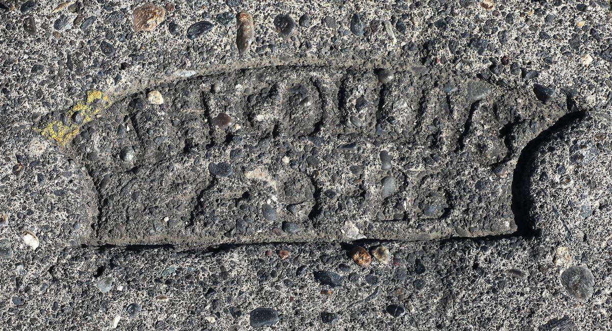 A historic concrete stamp dated from a century ago are interspersed on what’s currently named Columbia Park Trail in Kennewick’s Columbia Park.