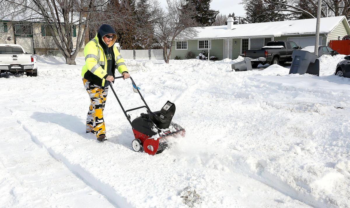 Jim McGrogan uses his new snow blower to clear snow from his driveway on Franklin Street in Richland. McGrogan said he bought the blower after a city plow ended up blocking the cul-de-sac’s driveways.