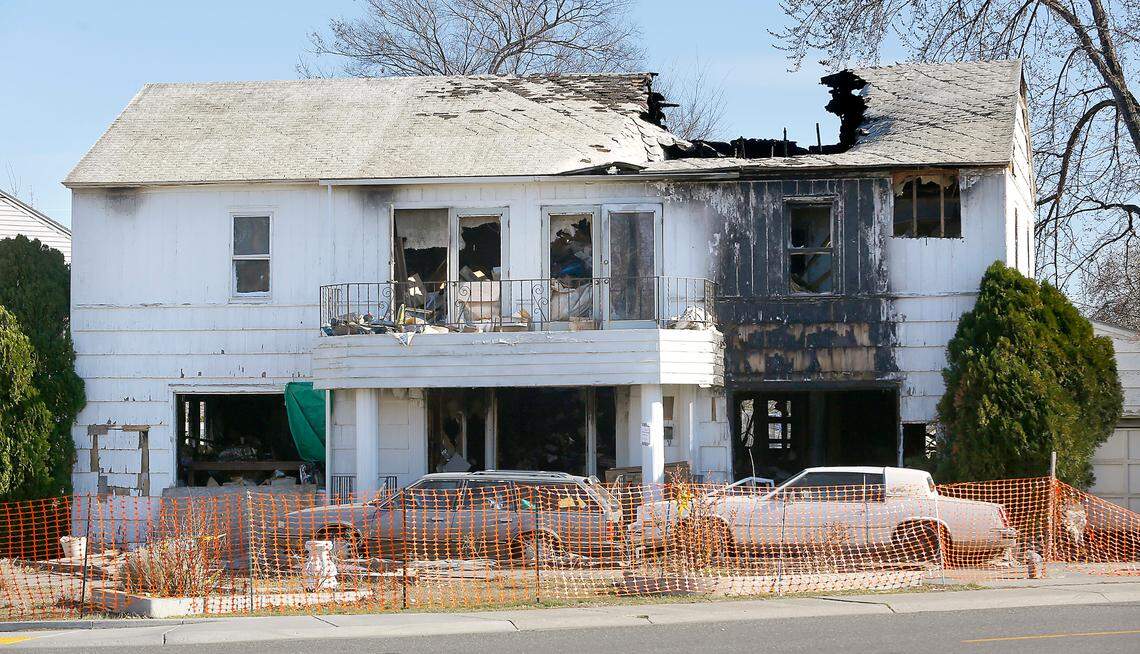 Richland residents are questioning why a dilapidated house that was destroyed by fire last summer is still standing.