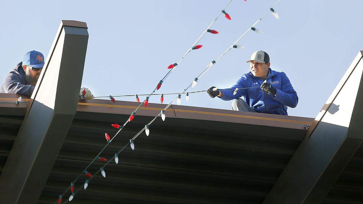 City of Richland employees install holiday lights in 2017  at the community stage in John Dam Plaza along George Washington Way in Richland. The same work has already started for this year’s holiday celebration that kicks off this week.