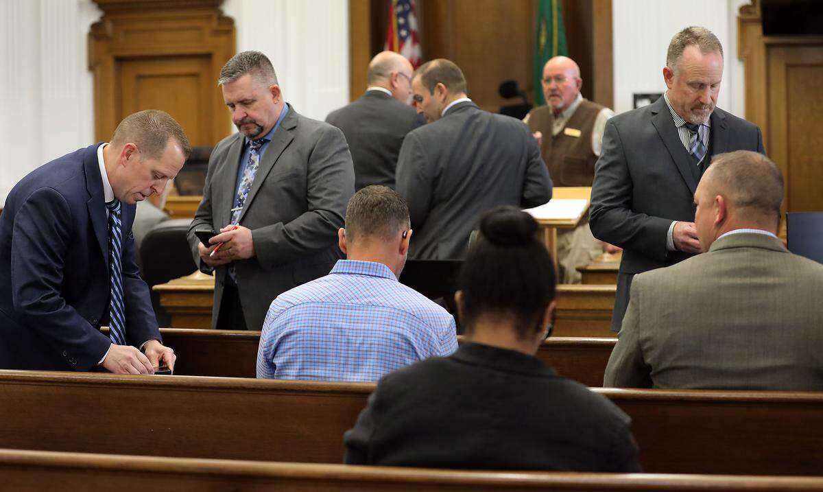 From left, Jason Erickson, Erik Magnuson, Jon Law, Steve Caughey and Mat Clarke arrive Thursday in a Walla Walla County Superior Courtroom for the second day of the jury trial against Benton County. A Walla Walla jury will decide if they should be paid for the retaliatory conduct of ex-Sheriff Jerry Hatcher.
