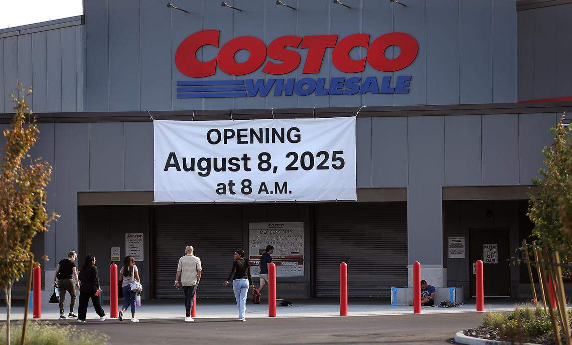 Employees walk into the new Costco Wholesale store at 3125 Queensgate Dr. in Richland.