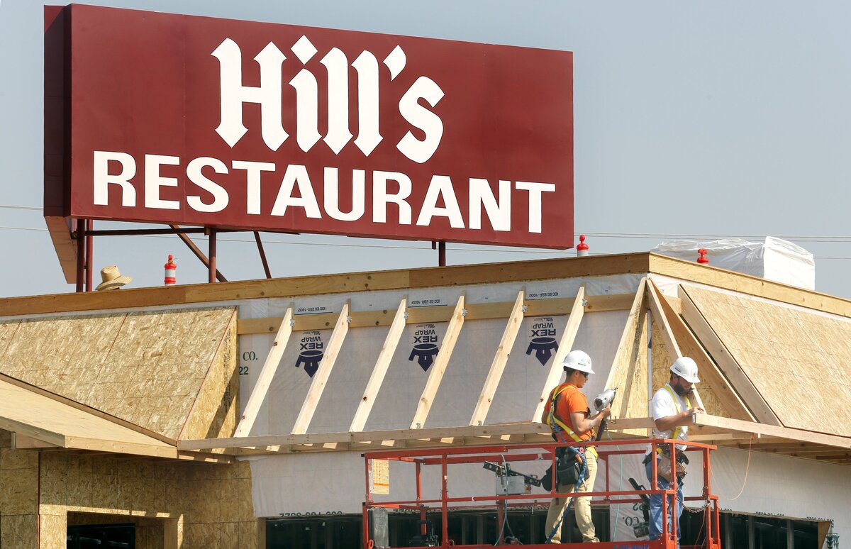 G2 Construction workers Jose Rodriguez, left, and Jimmy Childress team up Tuesday on rebuilding Hill’s Restaurant, 24 Vista Way in Kennewick. A kitchen fire closed the popular eatery in October 2016. Much of the fire-damaged building was torn down earlier this year and crews have been busy rebuilding it. They recently added the landmark sign. Owner Nancy Galstad expects to re-open later this year.