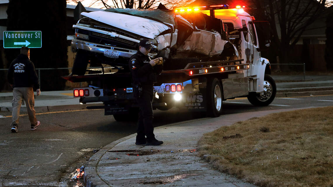 Pickup truck crushed after slamming into Kennewick roundabout. 2 men seriously hurt