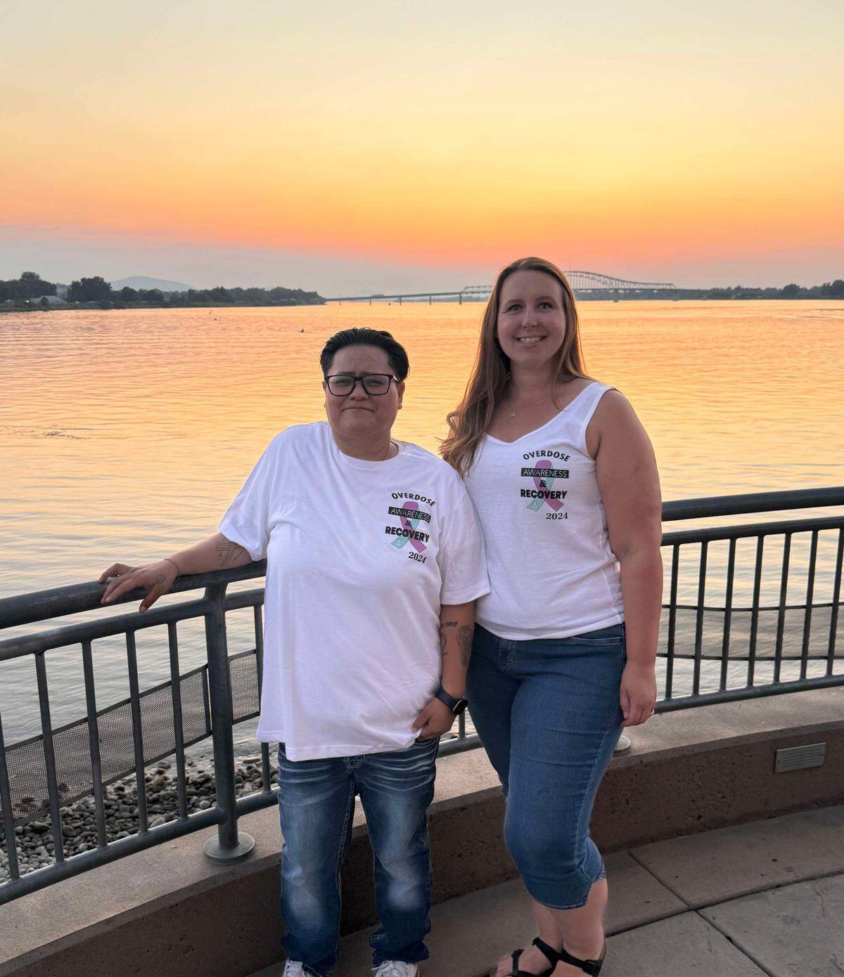 Nancy Delgado, left, and Sarah McCann are two of the Hands Across the Bridge Tri-Cities organizers.
