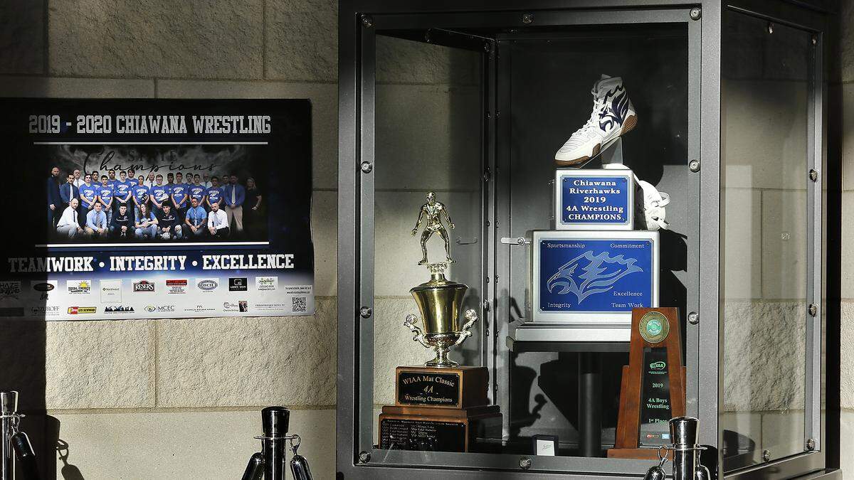 The Chiawana Riverhawks 2019 4A state wrestling championship team trophy is prominently displayed in the school’s cafeteria area. The team will be taking nine wrestlers to Tacoma this week, four of them regional champs.
