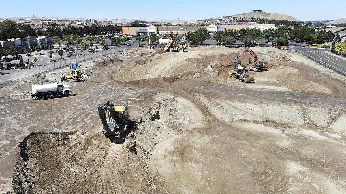Construction equipment digs out the footprint of the new 10-screen Fairchild Cinemas building Wednesday on the 2900 block of South Quillan Street in Kennewick. The cinema will have reclining seats and sell alcohol, traditional movie concession snacks and entree items. The Tri-Cities company also operates cinemas in Pasco, Richland and Moses Lake.