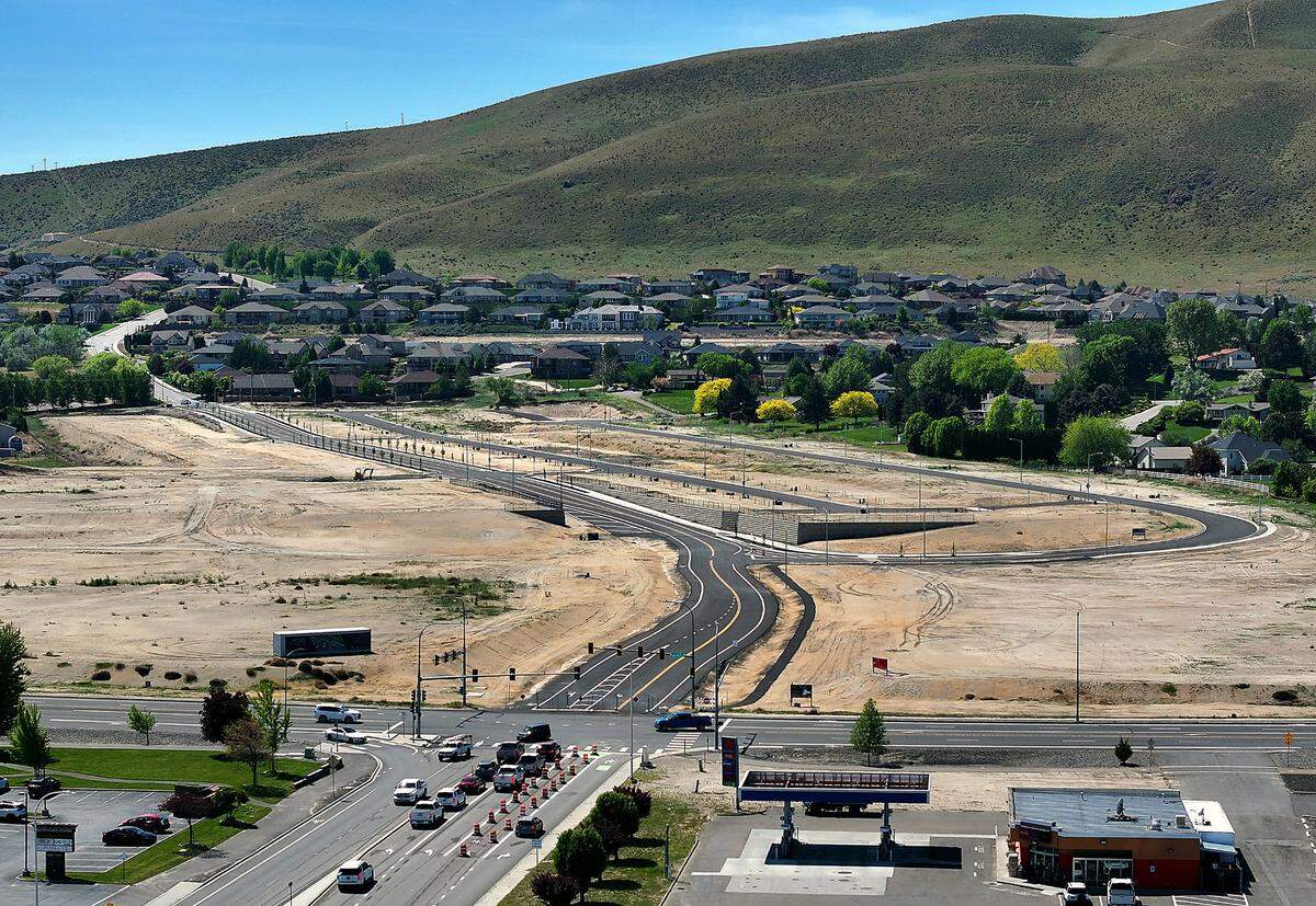 The newly paved stretch of Queensgate was put in by the developer of 48-acres of vacant land at the intersection in south Richland.
