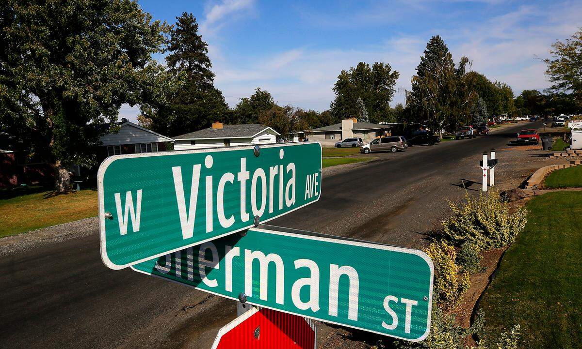A Kennewick woman died this week after she was reportedly mauled by two pit bulls who entered her home on West Victoria Avenue.