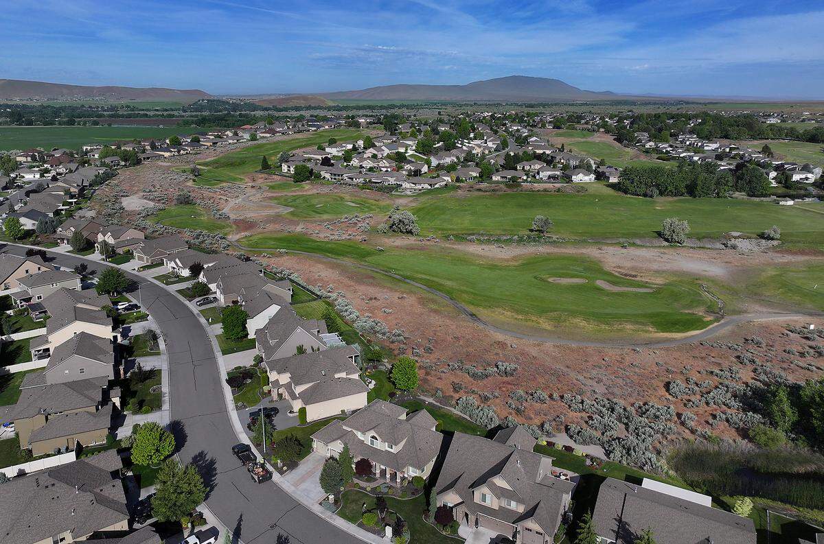The Horn Rapids Golf Course and housing community is off Highway 240 and Kingsgate Way in Richland. This view shows open land near homes on Crosswater Loop, at left, adjacent to the golf course.