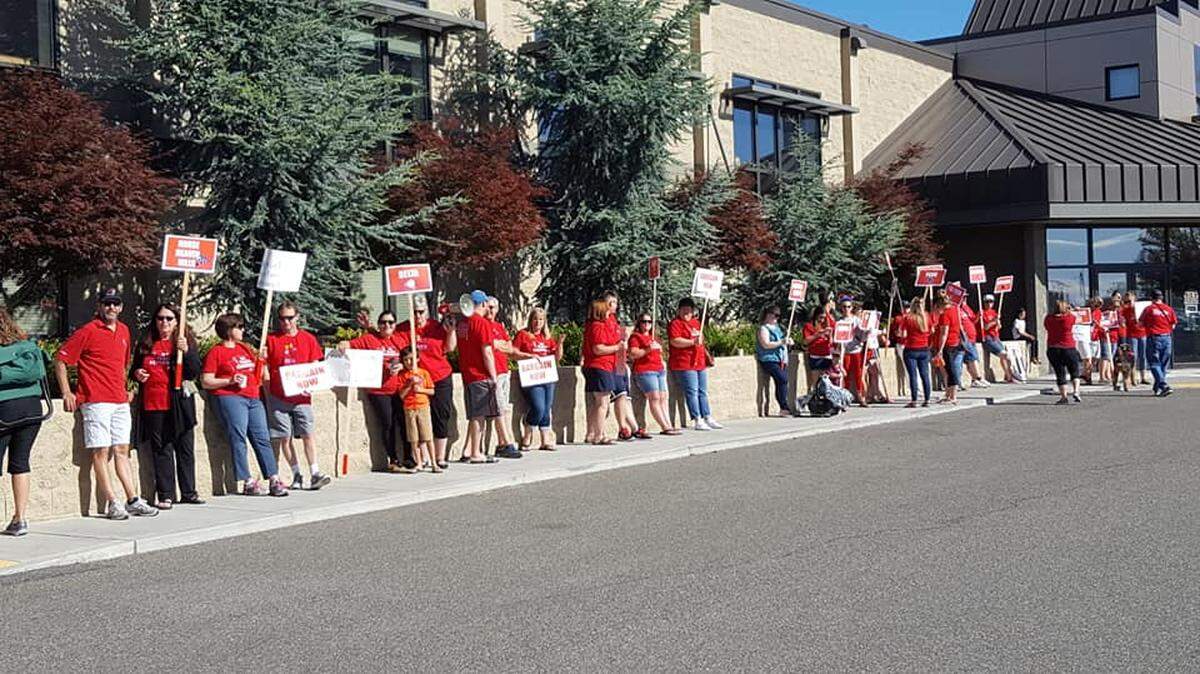 Kennewick teachers rally on June 14 at the school district office.