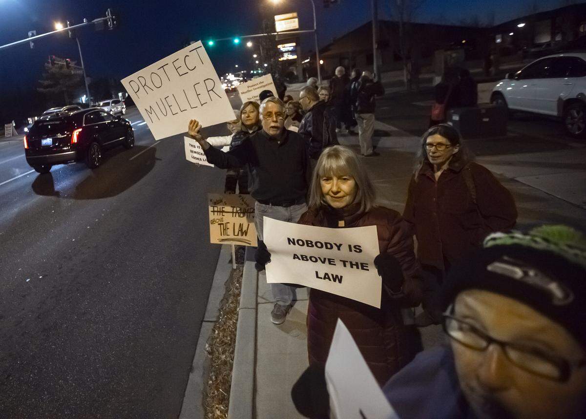 Tri-Citians line up along George Washington Way near John Dam Plaza in Richland to protest in support of the Mueller investigation. About 300 people attended.