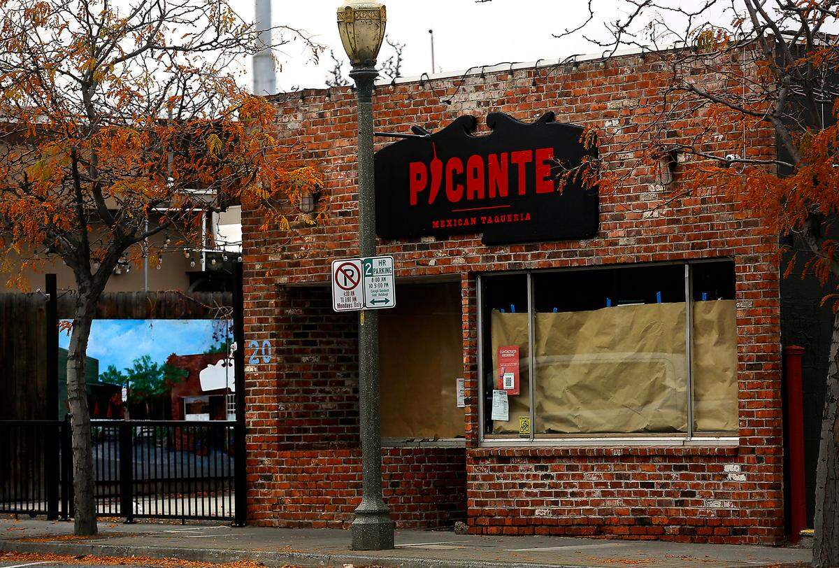 A sign advertises for a new storefront location of Picante Mexican Taqueria at 20 S. Auburn St. in downtown Kennewick.