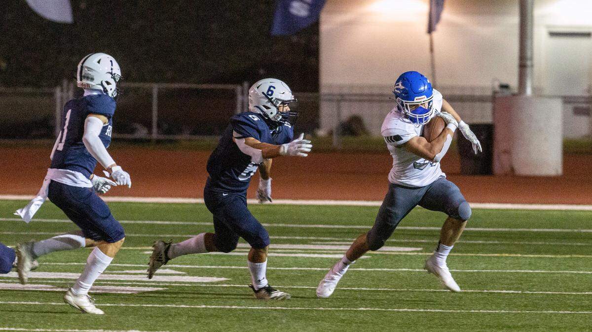 Chiawana along with Kamiakin and Kennewick high dominated the Mid-Columbia Conference all-star team that was released Wednesday. Picture is defenders Jalen Webber, left, and Isaac Hoag, center, chasing down Walla Walla running back Jake Humphrey in March when the Riverhawks beat the Blue Devils 35-7. (file)