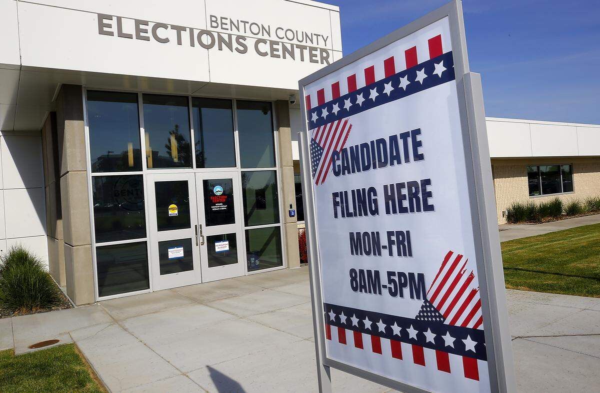 A sign is posted outside the Benton County Elections Center in Kennewick for candidates.