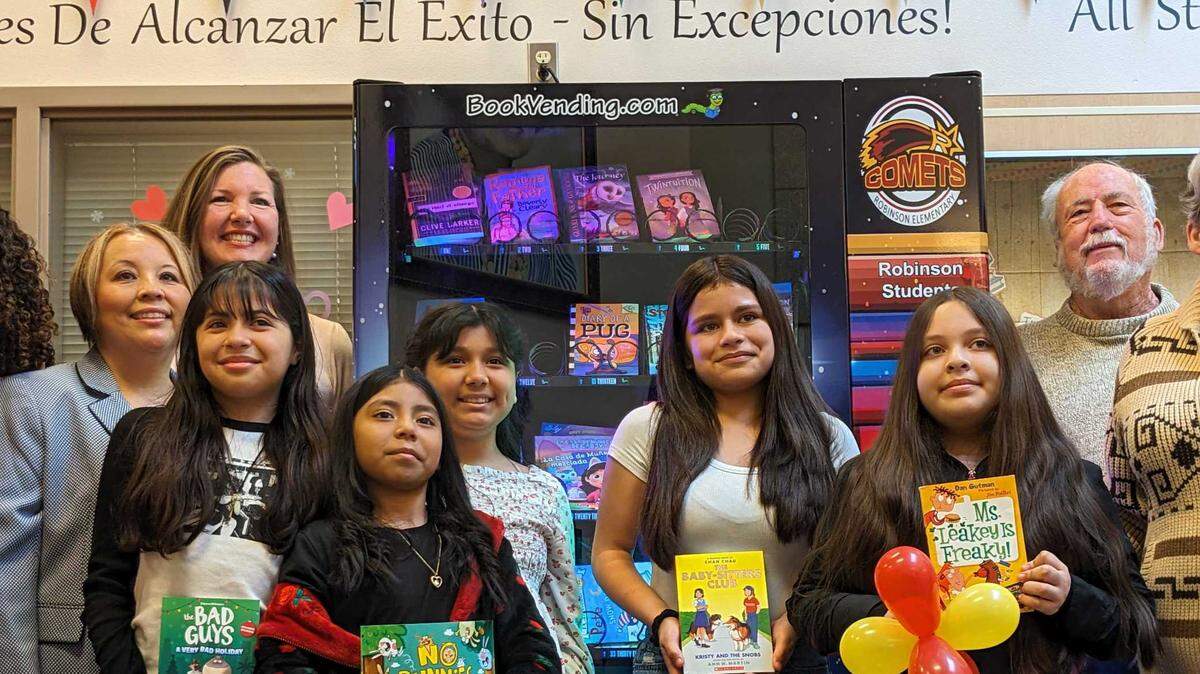 The Pasco School District unveils a new book vending machine at Virgie Robinson Elementary during an event with students, staff, financial contributors and the family of the late Virgie Robinson.