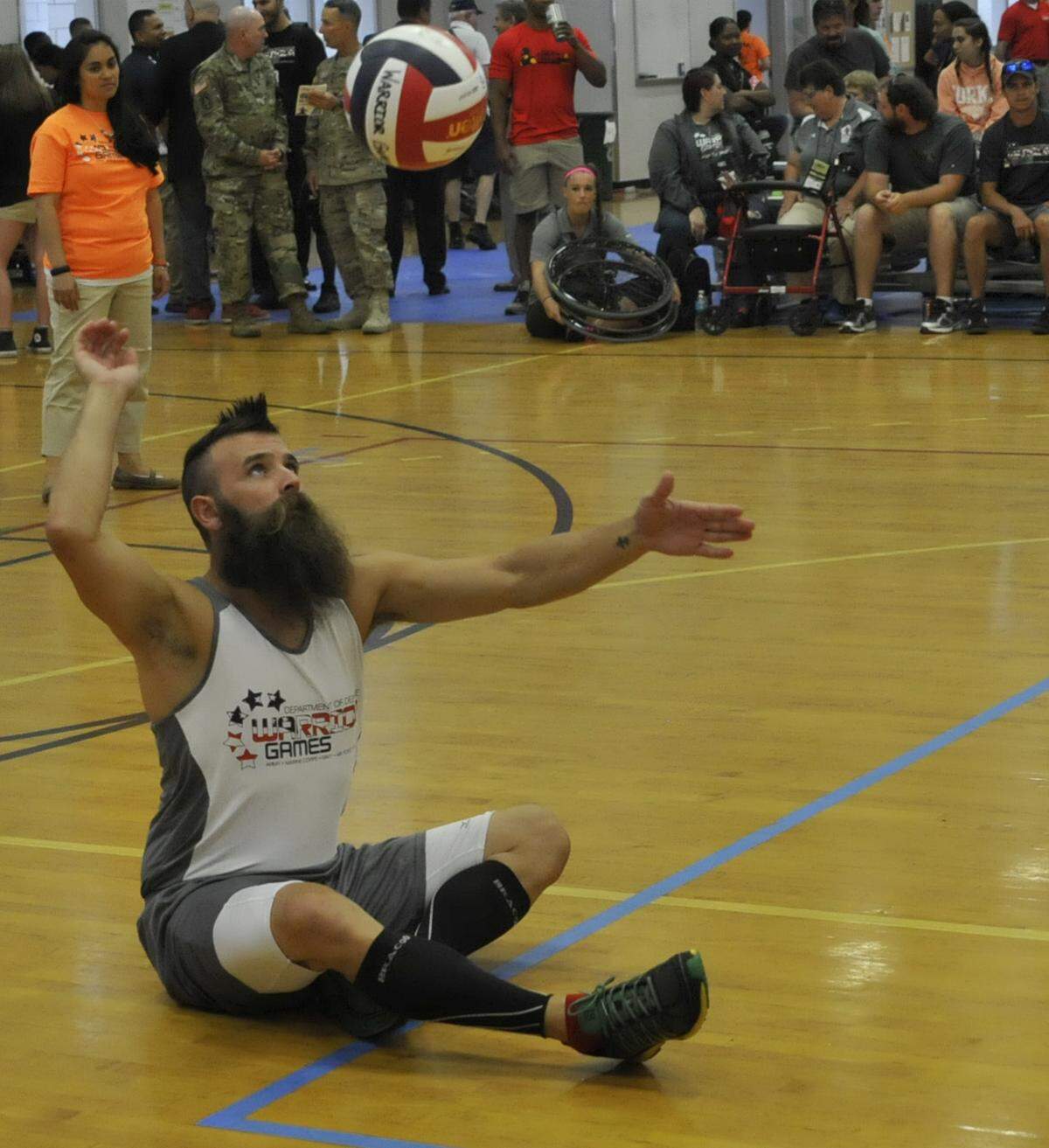 Army Veteran Sgt. 1st Class Fred Lewis, a sitting volleyball team member, serves up the ball at the 2016 Department of Defense Warrior Games at the U.S. Military Academy in New York.