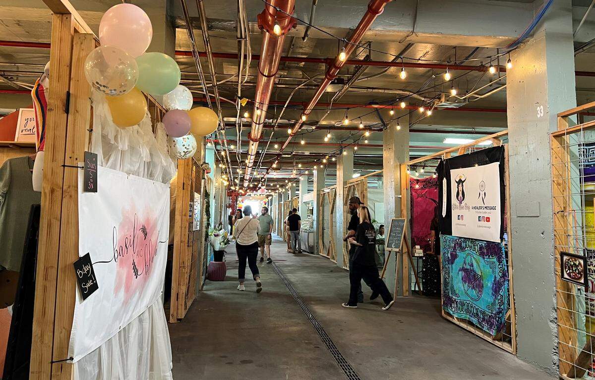 Shoppers check out the stalls at the Public Market at Columbia River Warehouse. The market is now open, at 10 E. Bruneau Ave. in downtown Kennewick.